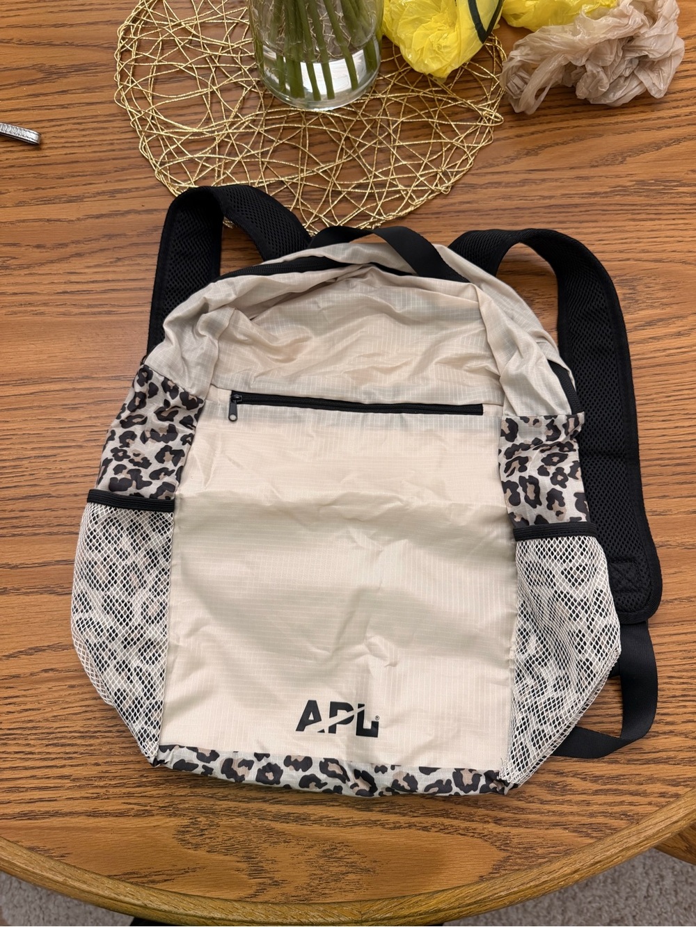 APL Beige TRAVEL Backpack with Leopard Accent and folds into small pouch..